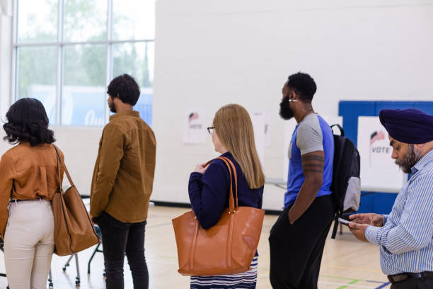 istock Diverse citizens wait patiently to receive ballots 1592133765