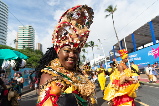 Woman (passista) celebrating and dancing at brazilian carnival