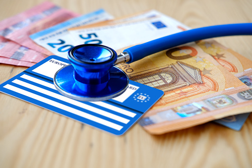 European health insurance card, euros money, medical stethoscope, concept international Travel insurance EU and EFTA traveling, medical support on trip to Europe, healthcare coverage, peace of mind