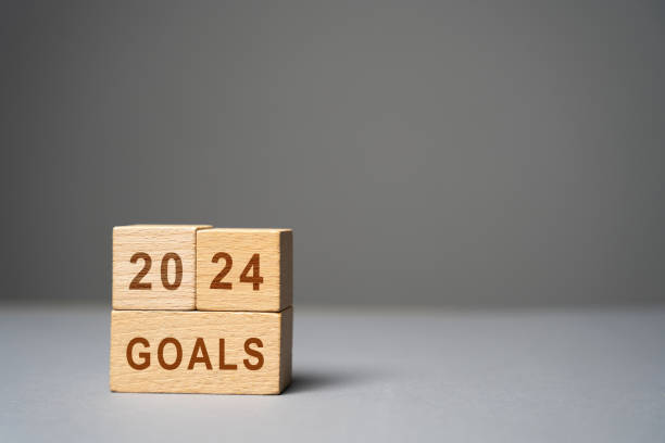 istock 2024 goals concept. Planning strategy, plans and tasks. New business ideas. Setting goal, target. Motivation, inspiration. The inscription on wooden blocks 1592150229