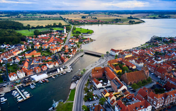 istock Small old town with harbor near inlet 1592150233