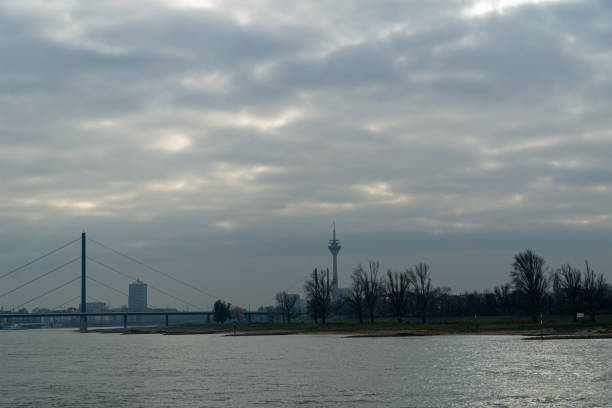 istock View to river, coast and bridge with cloudy dramatic sky 1592152914