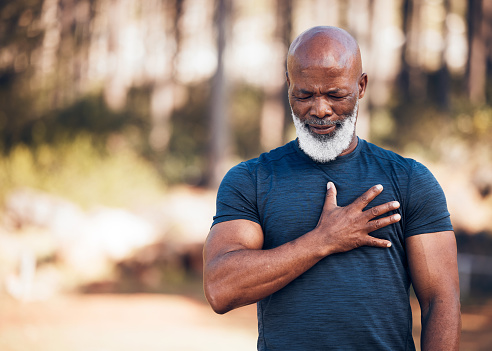 Black man, heart attack and health for outdoor exercise, park and running workout. Senior sports male, chest and stroke for fitness emergency, asthma and muscle pain from cardiac injury, risk or body