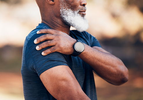 Senior hands, shoulder pain or injury in nature after accident, workout or training. Sports, health or elderly athlete man with fibromyalgia, inflammation or tendinitis, arthritis or painful arm.