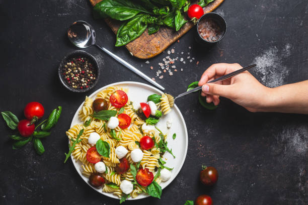 Pasta with mozzarella and tomatoes .Pasta caprese