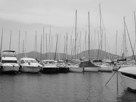 Many luxury yacht moored at a harbour of Lago di Garda, Italy.
