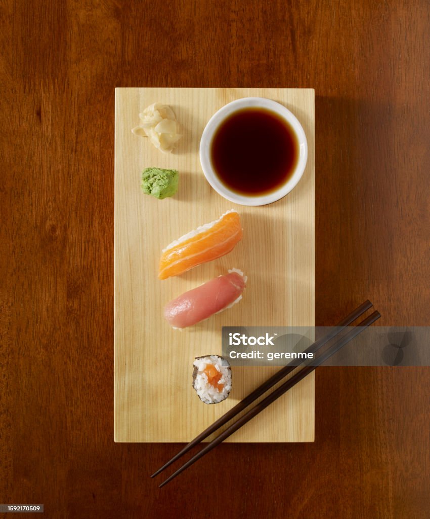 Sushi rolls Sushi roll serving with soy sauce, wasabi and ginger on wooden table top Avocado Stock Photo