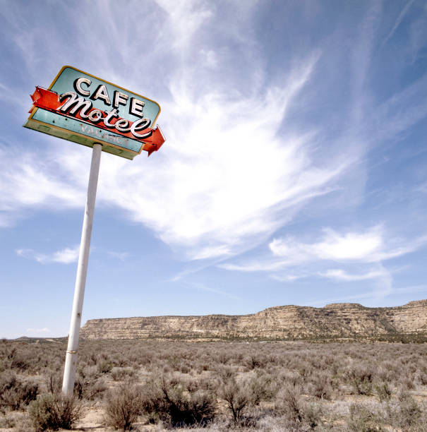 Old rusty cafe motel sign in the desert. This photo has been made on public domain