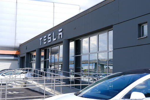 Tesla office, American company, electric car manufacturer Elon Musk, sales center, alternative energy development concept, electric vehicle production, Innsbruck, Austria - June 2022