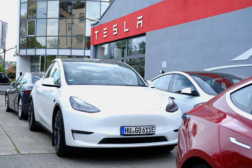cars parked in Tesla office, service station, American electric car manufacturer Elon Musk, current and major repairs, alternative energy concept, electric vehicle production, Frankfurt - May 2023