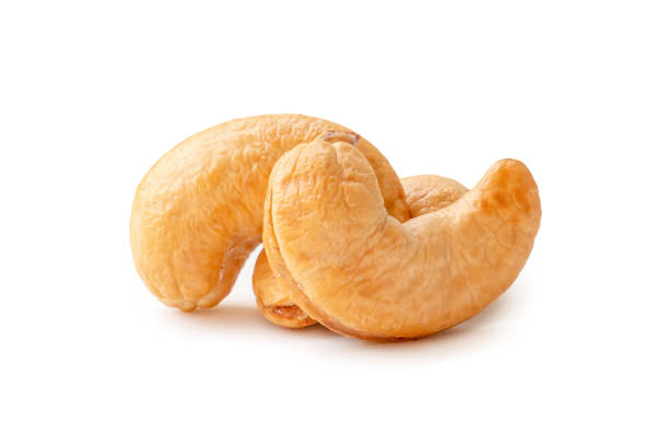 Front view of three Roasted brown cashew nuts in stack isolated on white background with clipping path. Close up photo