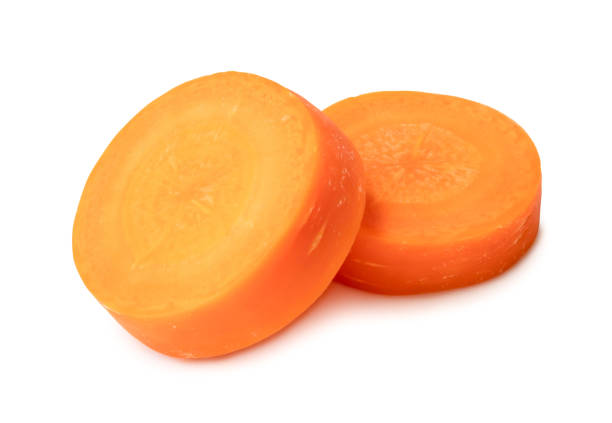 istock Two fresh beautiful orange carrot slices isolated on white background witch clipping path. Front view. 1592232017