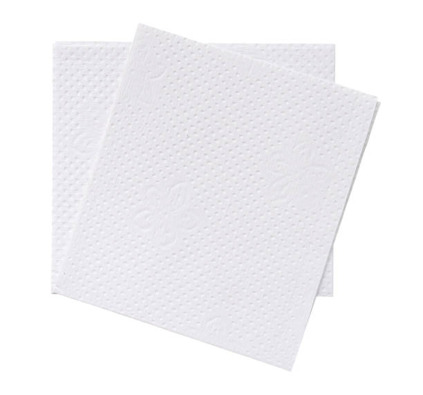 istock Top view of two folded pieces of white tissue paper or napkin in stack isolated on white background with clipping path. 1592232549