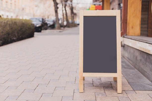 istock Chalkboard menu sign mockup - Copy space menu blank blackboard sign empty space for advertising 1592248707