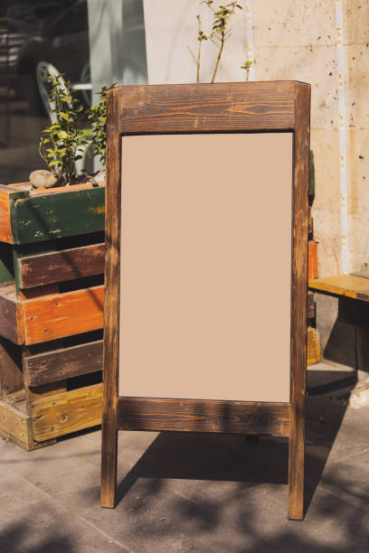 istock Chalkboard menu sign mockup - Copy space menu blank blackboard sign empty space for advertising 1592249805