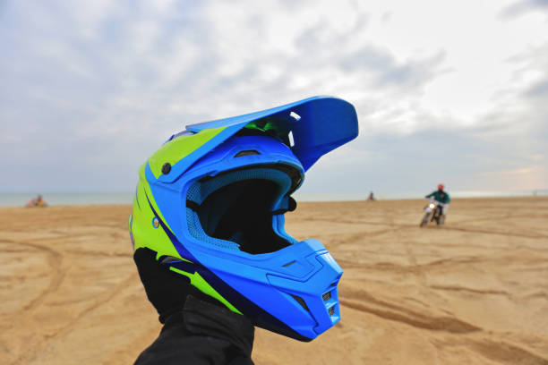 istock Motocross helmet in the hand 1592252577