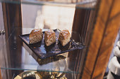 Cakes with honey and nuts served in the cafe or bakery window. Homemade sweet bakery product