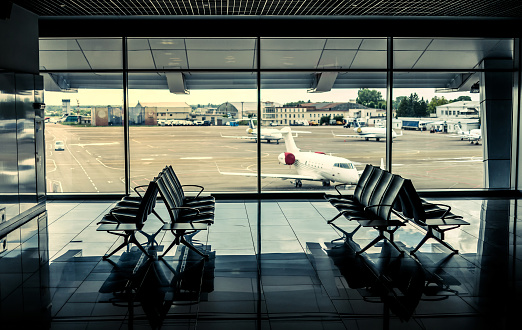 Kyiv, Ukraine - July 8,2016: empty airport terminal with view of the runway through the window