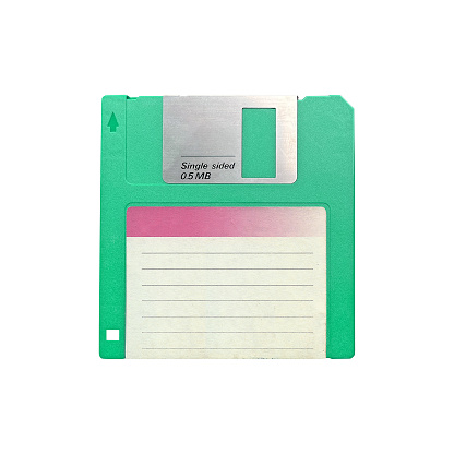 Old retro floppy disk isolated on white background, front view closeup cut out