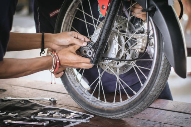istock Motorcycle mechanic check brake discs 1592327153