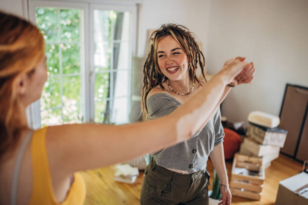 istock Happy couple dancing in new home 1592335904