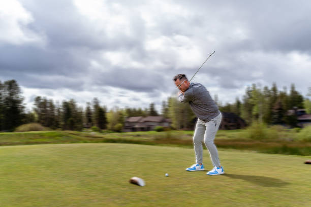 A golfer at the end of his swing with dramatic sky behind. http://blog.michaelsvoboda.com/GolfBanner.jpg