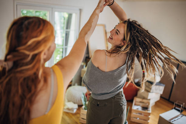 istock Happy couple dancing in new home 1592338057