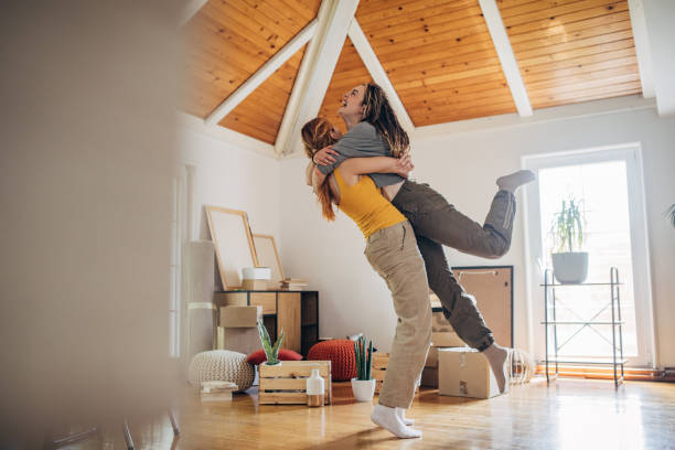 istock Happy couple hugging in new home 1592341340