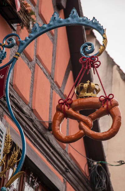 Pretzel shop signboard in Alsace where pretzels are very much appreciated snacks