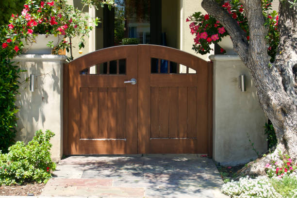 istock Craftsman style double garden gate opens to the courtyard 1592361162