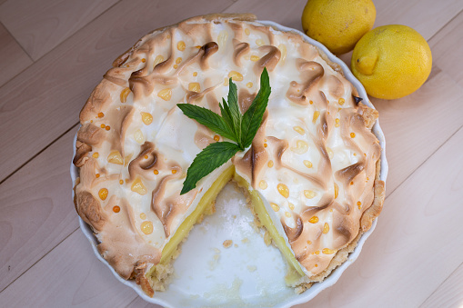 Lemon tart pie with meringue cream. Traditional American cake. Homemade baking. Copy space