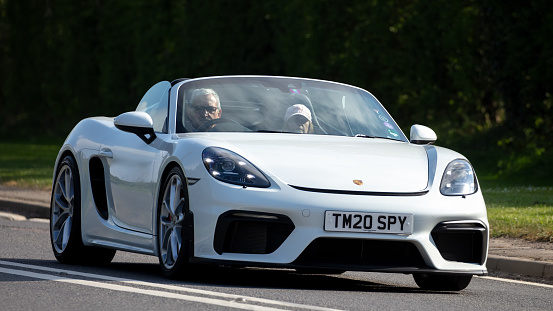 Bicester,Oxon,UK - June 19th 2022.  White 2020 Porsche 718 Spyder  car driving on an English country road