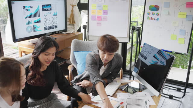 Asian group developer and ui designer designer brainstorming. Business person meeting together .