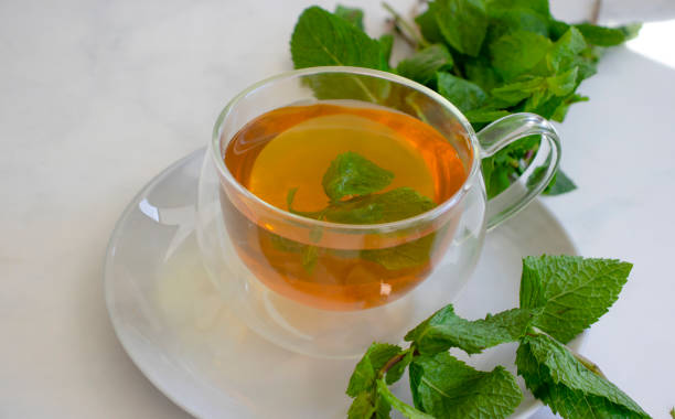 istock Cup of tea with fresh mint 1592505456