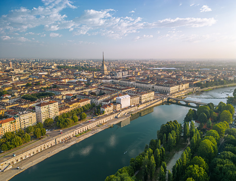 The drone aerial view of Turin city centre with Mole Antonelliana at sunrise, Piedmont region of Italy.