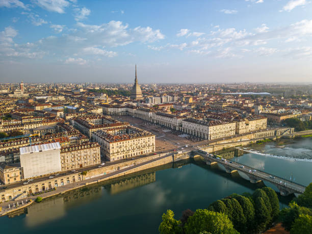 The drone aerial view of Turin city centre with Mole Antonelliana at sunrise, Piedmont region of Italy. The drone aerial view of Turin city centre with Mole Antonelliana at sunrise, Piedmont region of Italy. turin stock pictures, royalty-free photos & images