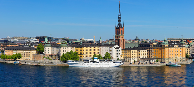 panoramic daytime view of the Stockholm skyline at dusk featuring Gamla stan and Riddarholmen (Sweden).
