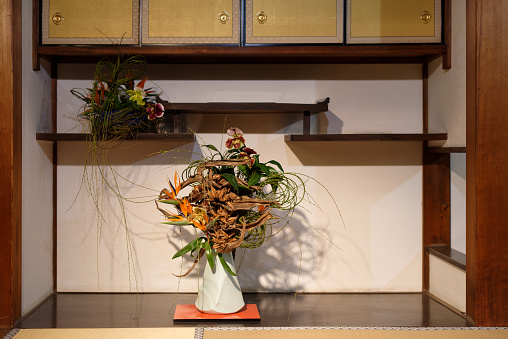 Traditional Flower Arrangement Techniques displayed on the shelves in traditional interior space in Kyoto city, Japan.