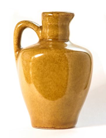 The Large earthenware jug isolated on white background.