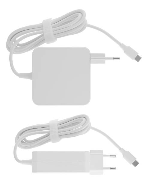 istock Laptop power adapter, computer spare part, on white background in insulation 1592537472