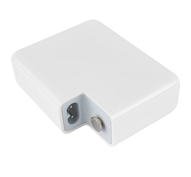 istock laptop power adapter, on white background in insulation 1592540023