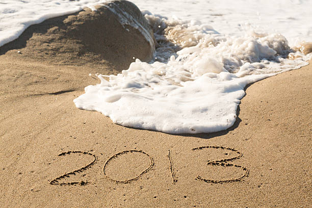 istock 2013 in sand being covered by sea waves 159255071