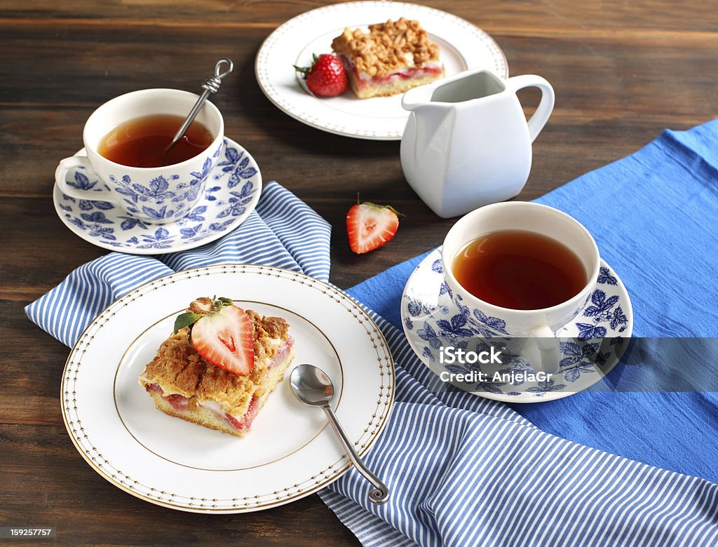 Strawberry cake and two cup of tea Backgrounds Stock Photo