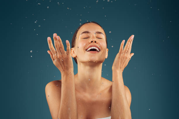 Girl washes her face
