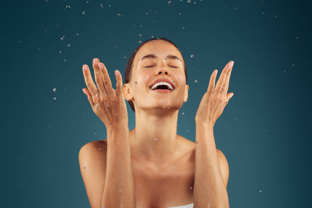 Girl washes her face stock photo