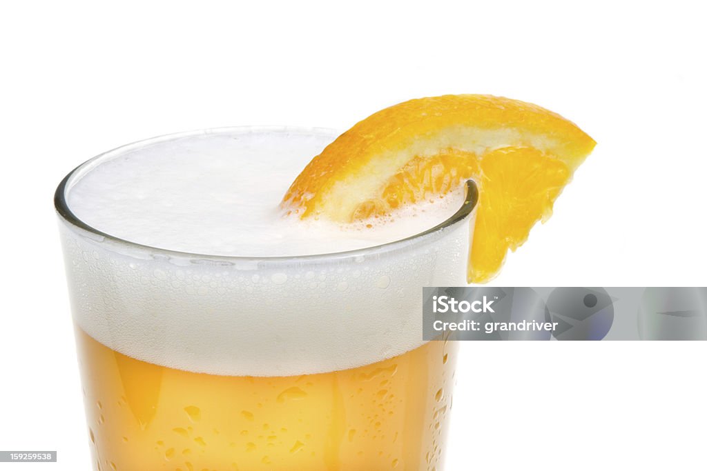 Microbrew Beer with Orange Slice Microbrew Beer with Orange Slice isolated on white Alcohol - Drink Stock Photo
