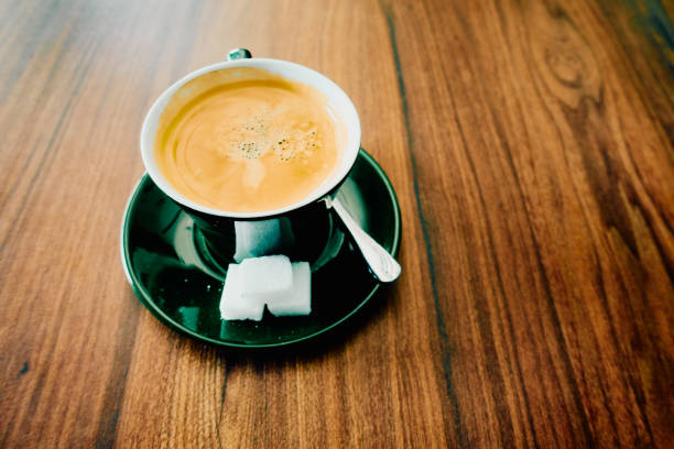Coffee with milk and a sandwich for breakfast