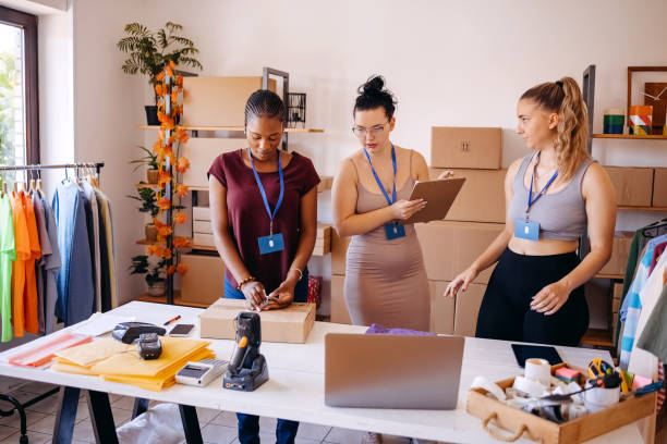 istock Picking and preparing clothes for delivery service 1592611316