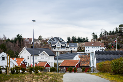 Lindesnes, Norway - April 09 2023: Large houses and boat houses.