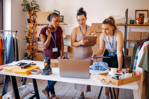 istock Young woman using laptop in her small business 1592611876
